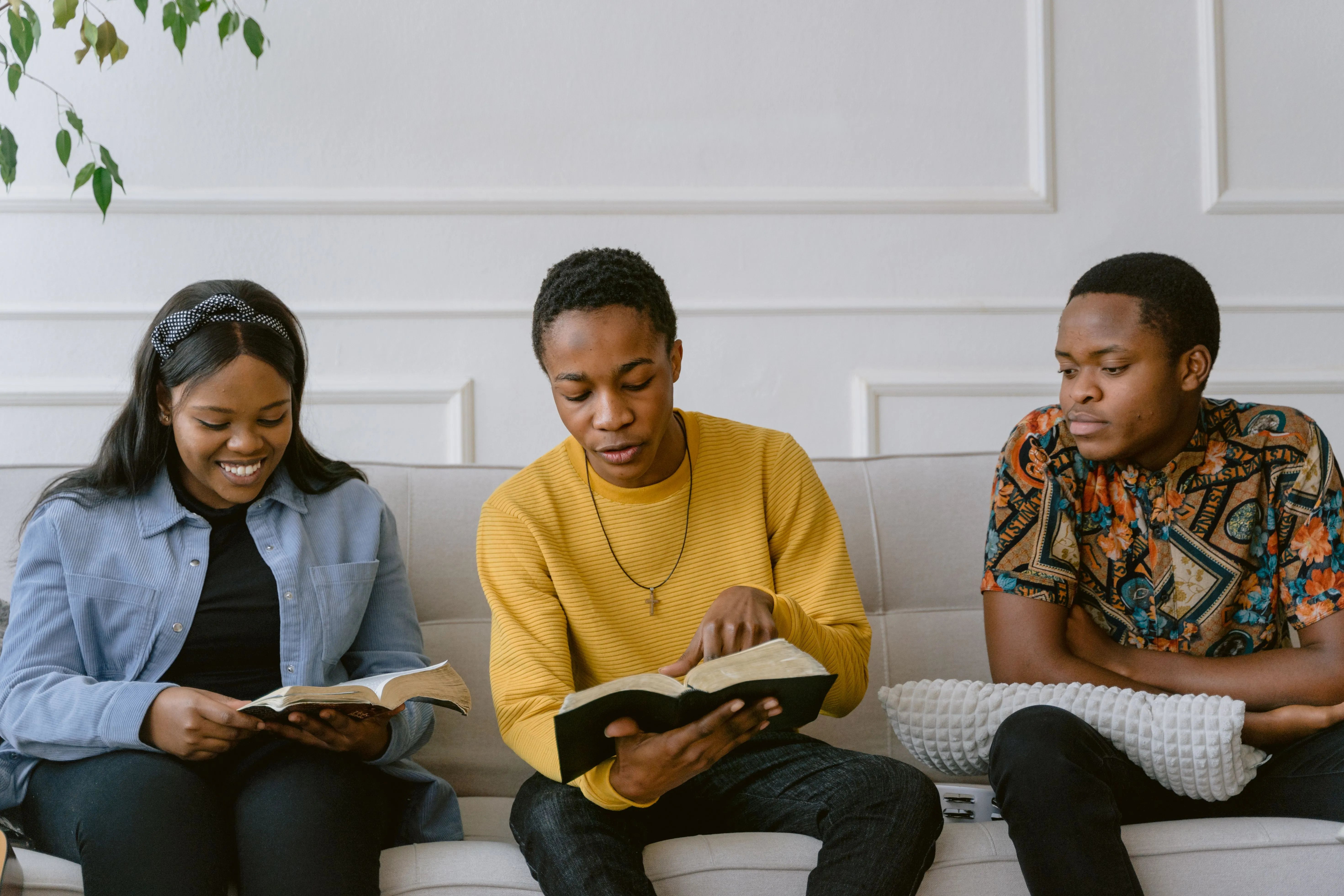 Three people studying together around a table