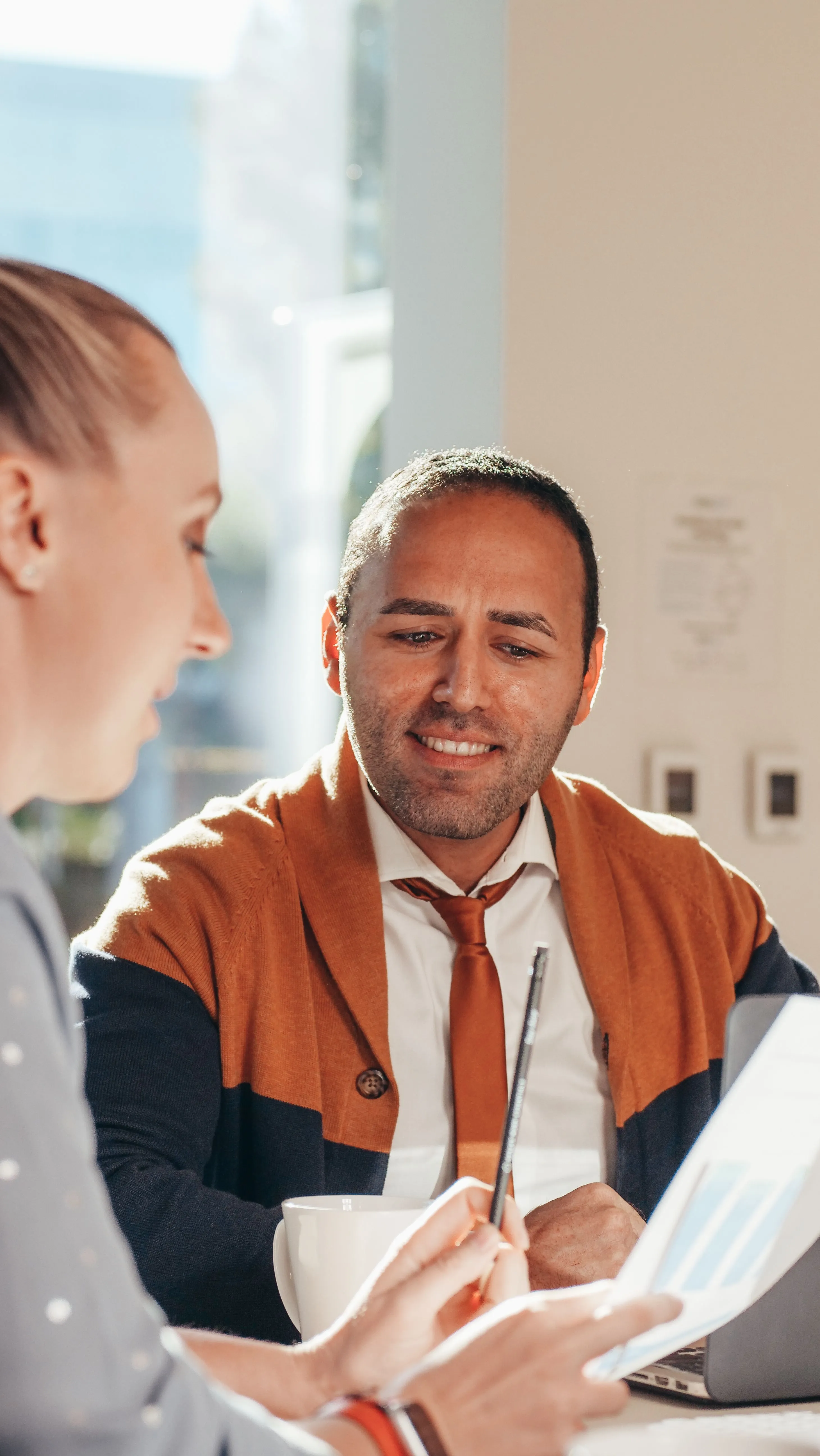 A woman sharing a graph during a meeting