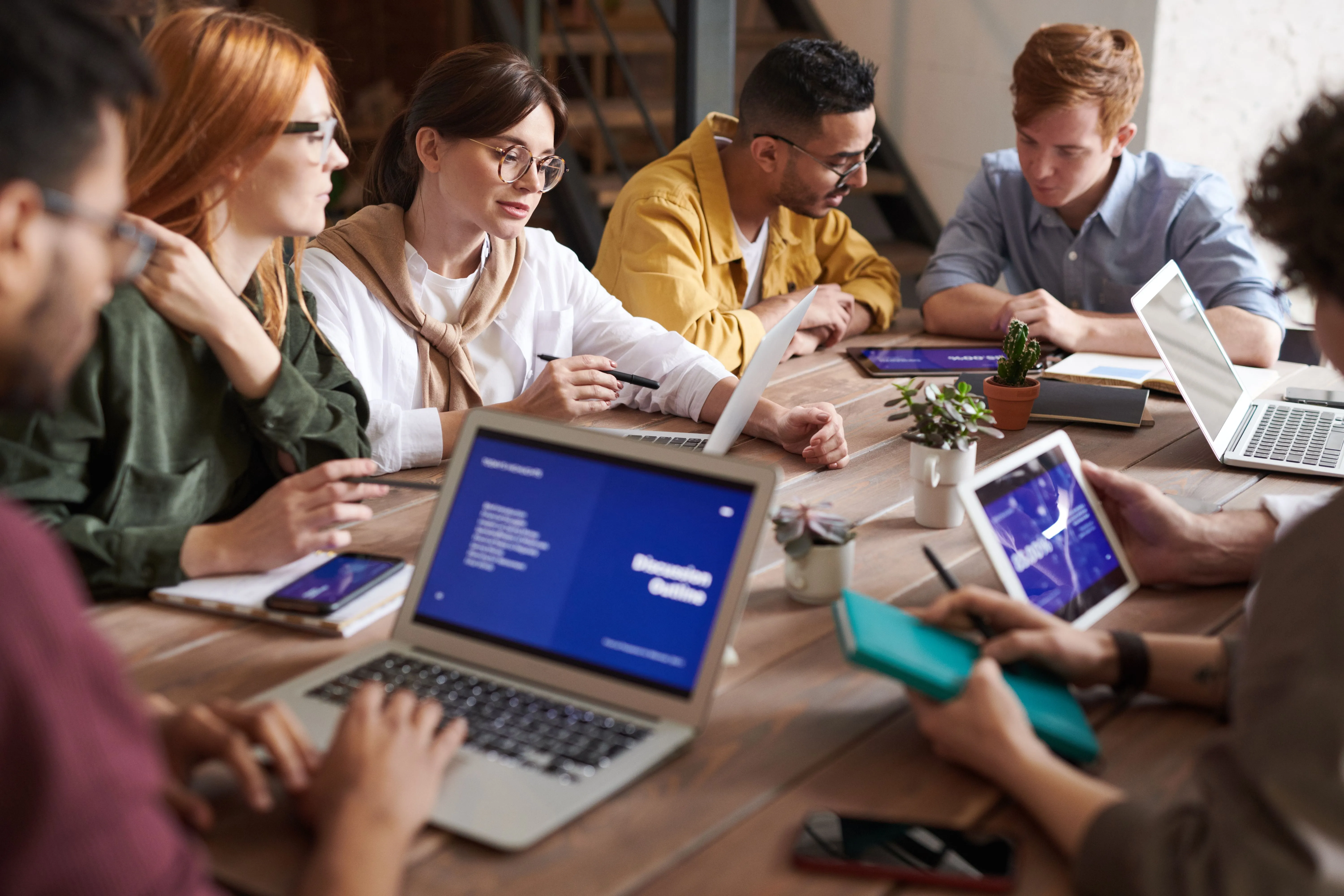 Colleagues working together around a table